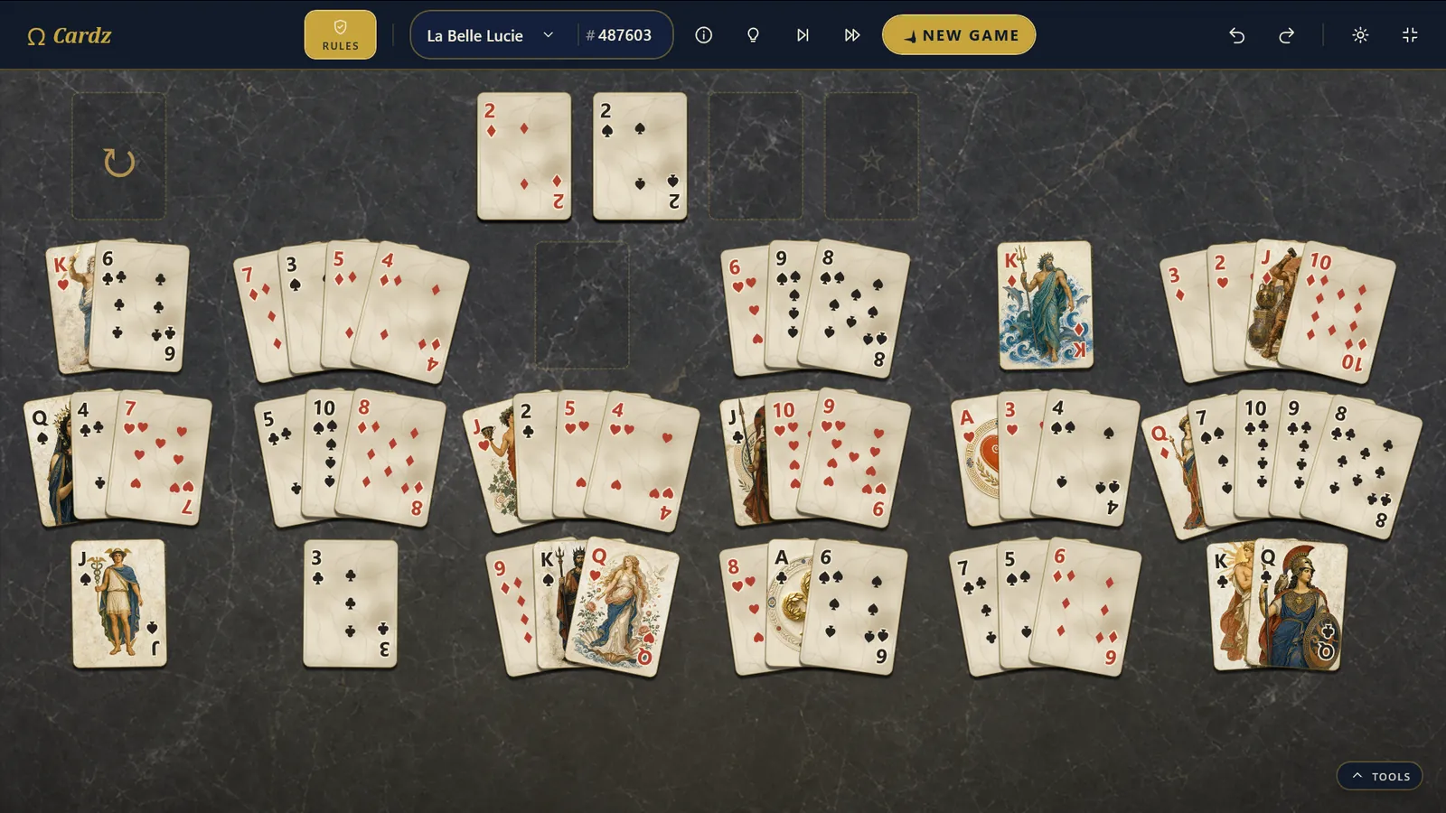 La Belle Lucie with the Olympus card deck, cards fanned in a radial layout
